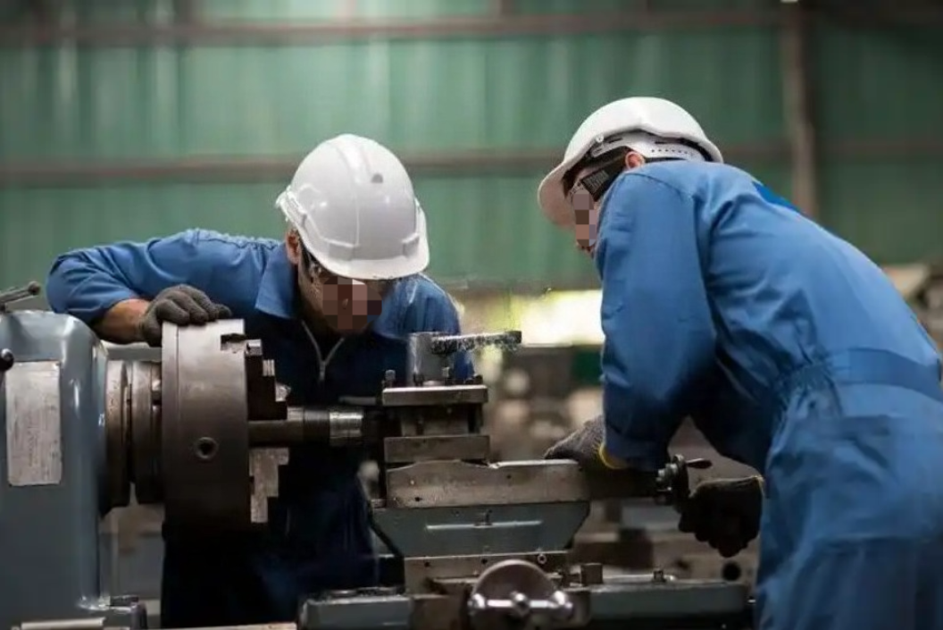 Operators working on nail machinery